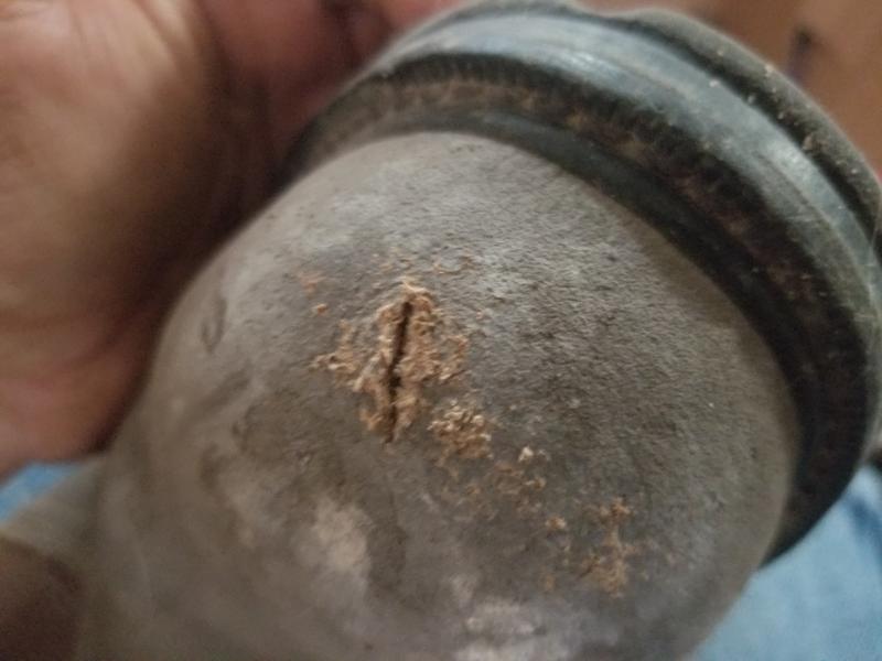 On my knees working on a water hydrant, gravel can not tear real leather