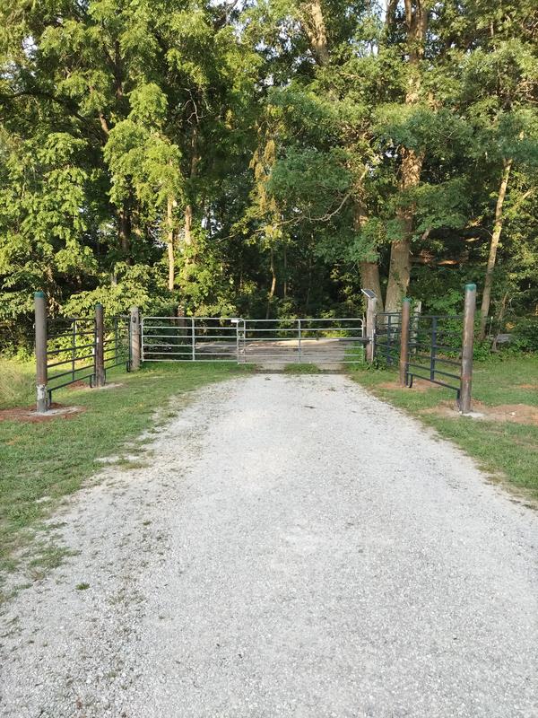 Extending gated entrance. Moving gates 20' further off road to accommodate truck and trailer.