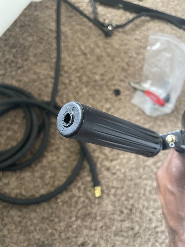 The broken spray gun assembly connection to hose.