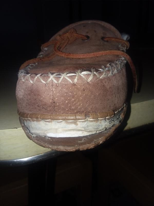 Slippers showing the cracked soles.