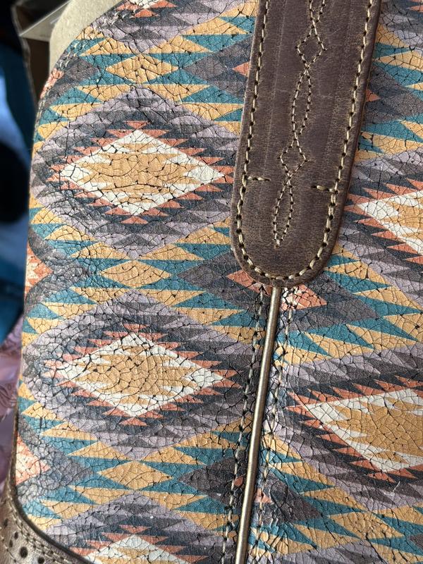 The cracking of the design on the boot