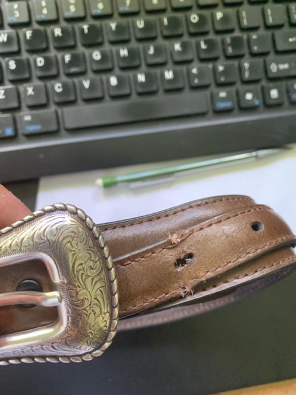 Outer side of belt "tongue" less than 30 days of use