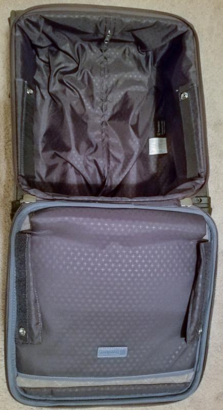 Bag unzipped, unsnapped and velcro released to open fully for packing.