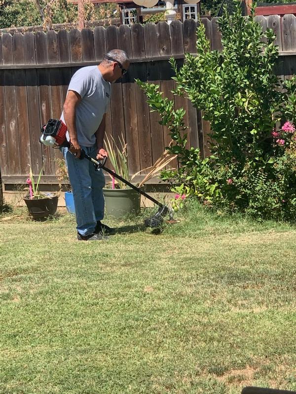 Husband using the trimmer.