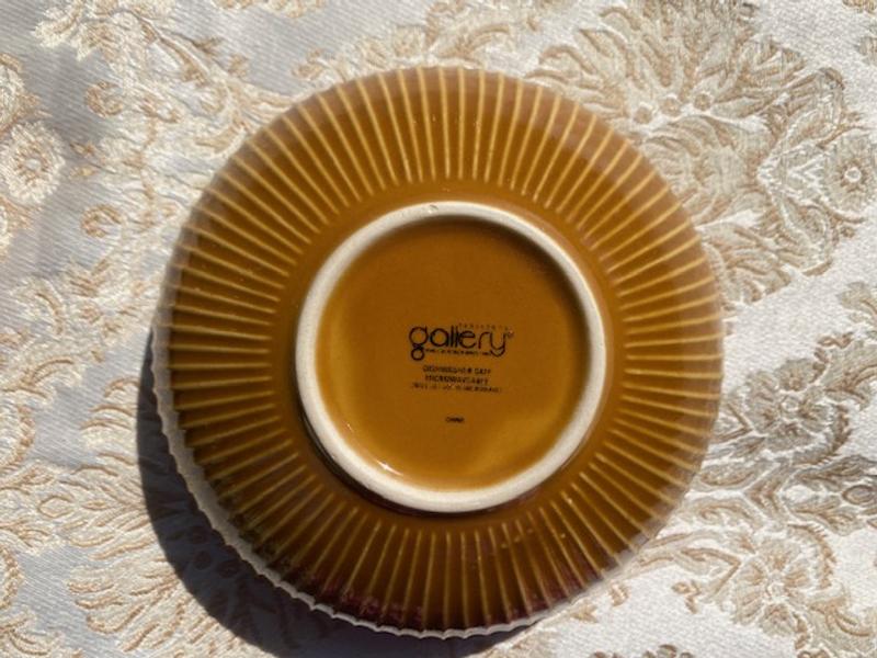 Bottom of the smaller soup bowl. Dishwasher and microwave safe