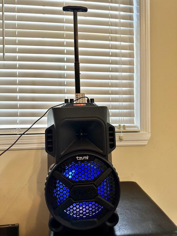 Speaker plugged in and playing music.