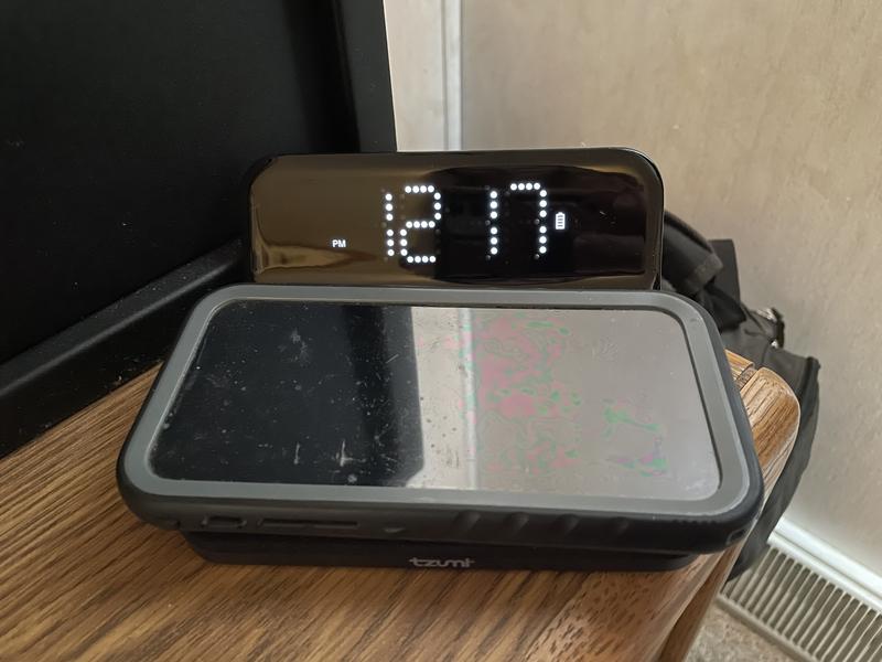 Alarm clock with wireless phone charger