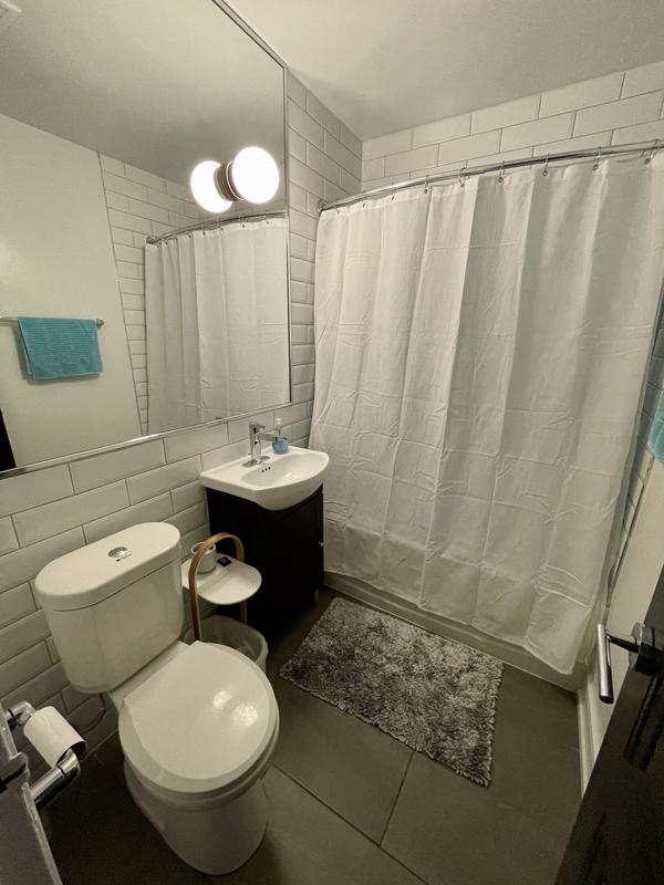 Between the toilet and sink