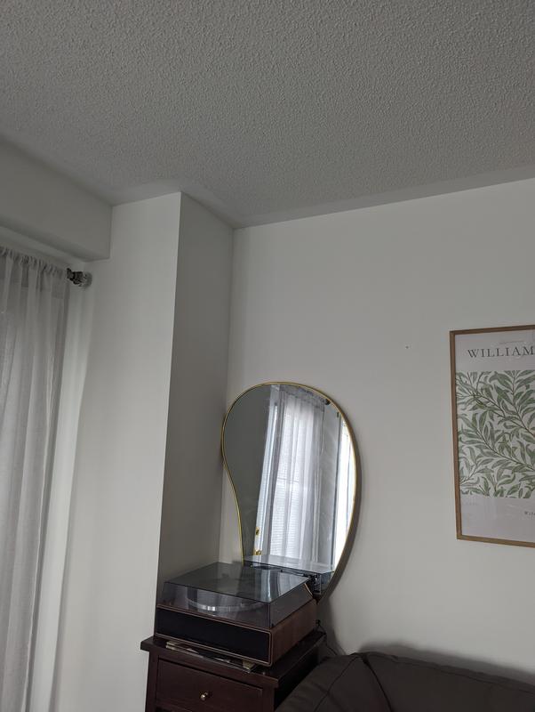Pebble mirror in corner of my living room