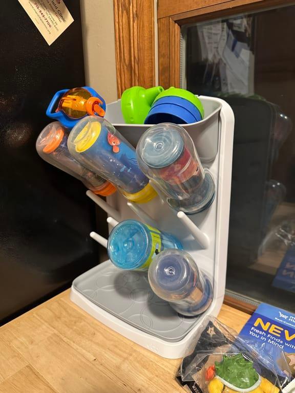 Keeps the sippy cups all together, and taking up less space
