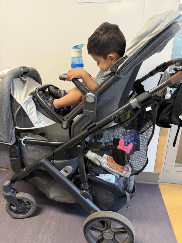 Toddler squished and feet on top of infant