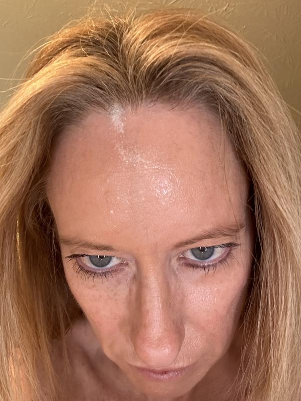 Tried spritzing on forehead. Product landed in my hair.