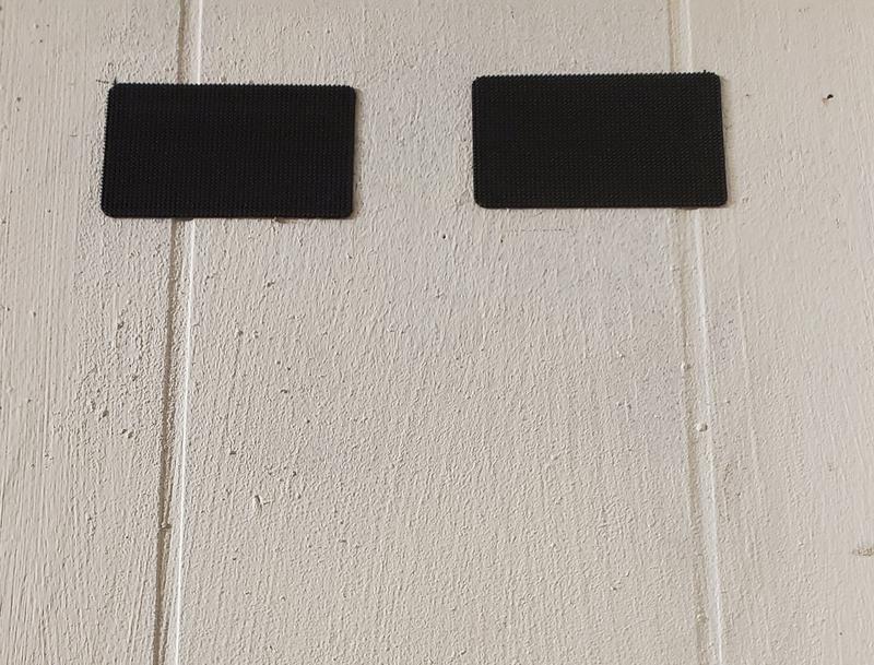 Velcro strips on the wall.