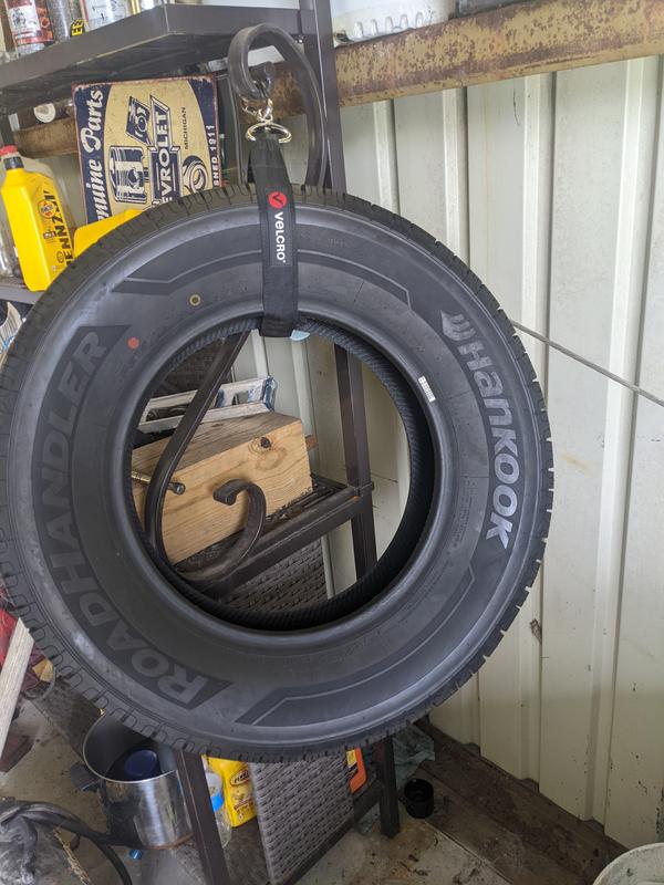 The large Velcro hook, holding up a tire.