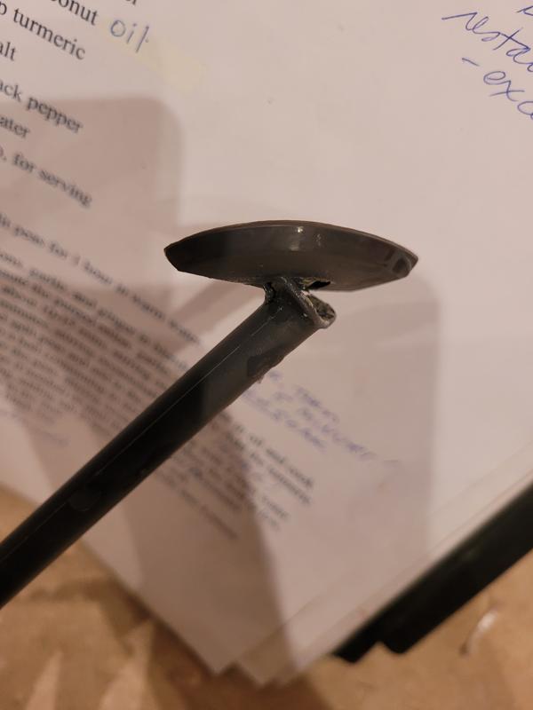 The scraper handle appears to be stuck into the head, but both are broken. I did not touch the blades with it.