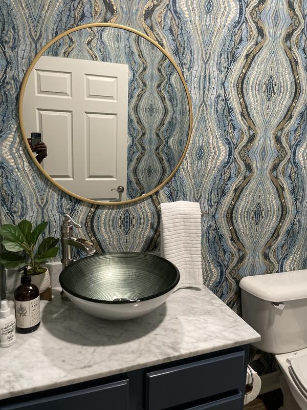 Vigo vessel sink and faucet in bathroom.