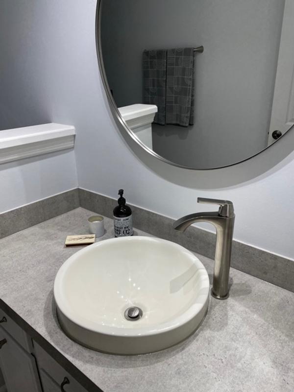 Begonia Matte Stone Vessel Bathroom Sink in White with Linus Vessel Faucet in Antique Rubbed Bronze Begonia Matte Stone Vessel Bathroom Sink in White with Linus Vessel Faucet in Antique Rubbed Bronze