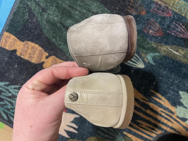 2026 gold on bottom; 2025 taupe on top. the gold back comes higher on your heel and is stiffer because of the thinner lining, cutting into you more easily.