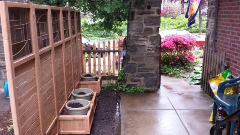 Divided courtyard with panels awaiting planting