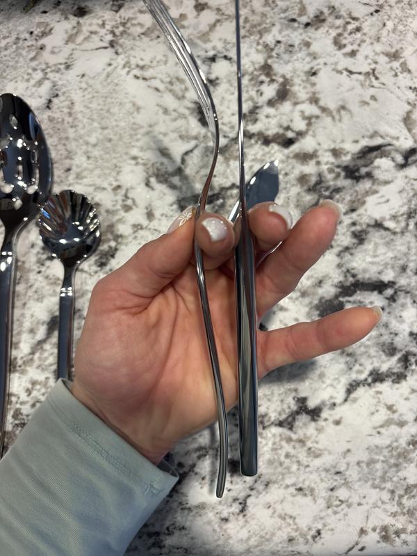 Comparing thickness of handles. Knife is thicker than all the rest.