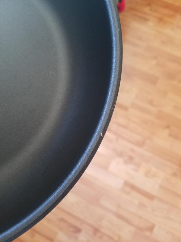 Edge of pan scratch. Have only had pan for a few weeks. Standard daily use.