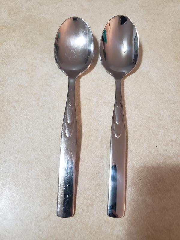 Old spoon next to new spoon