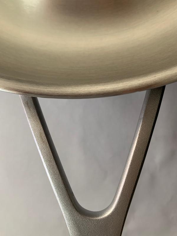 Yellowish/rust like line on the left side of the V handle. More visible in person