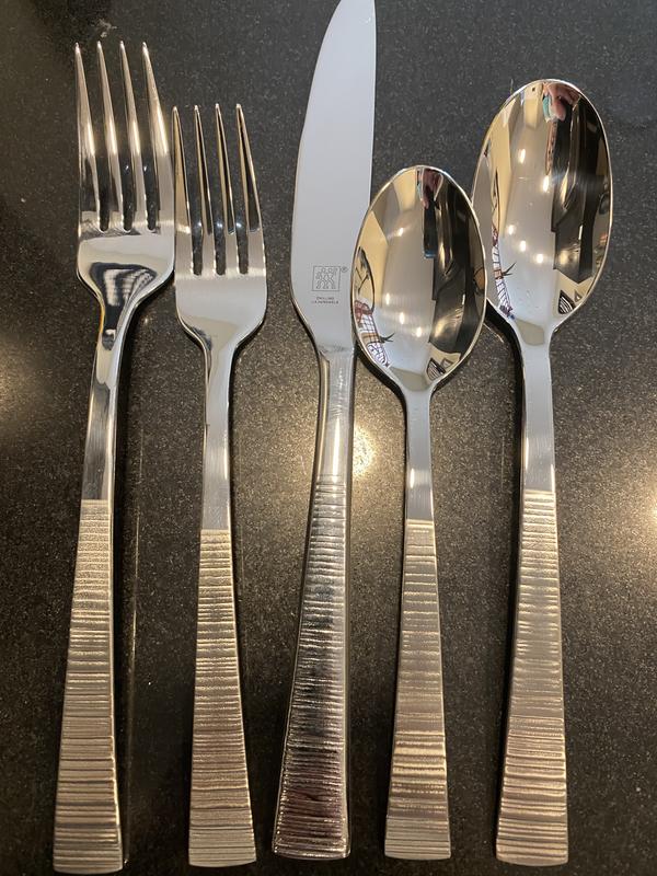Knives have shinier handles, both 20 pc sets are like this