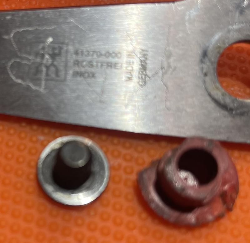 my gouged up red plastic “pivot nut”