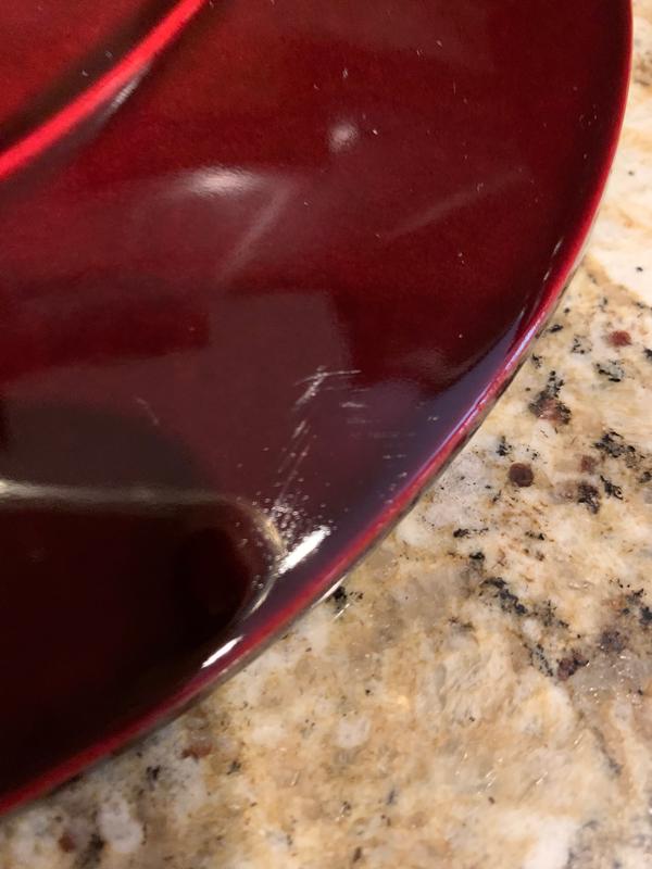 Scratches on lid right under and in front of "Staub" logo