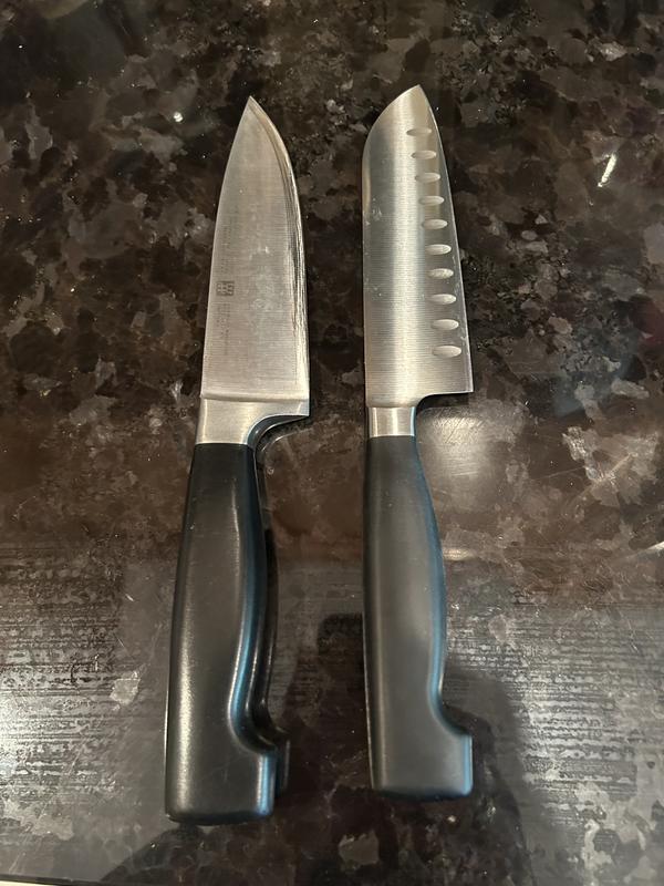 Santoku vs Chef showing sharp edge on former knife