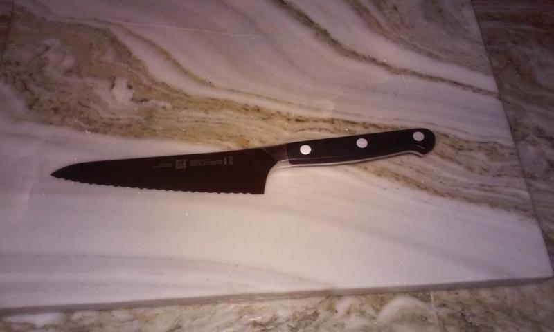 Zwilling 5.5" Serrated Prep Knife on Grainite Cutting Board